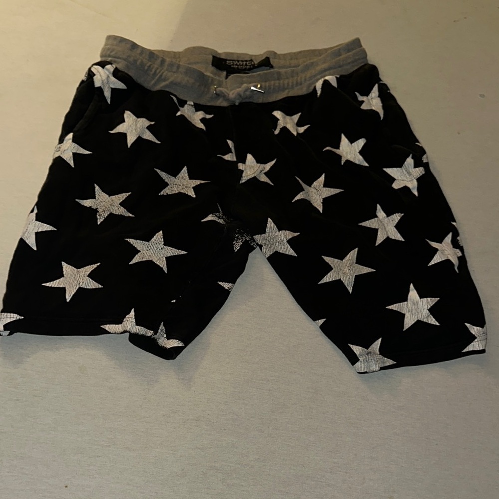 Mens Size XL Black Shorts with White Star Pattern.